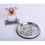 A silver card game stand, height 10cm, together with a Swedish silver coaster, marked GAB (