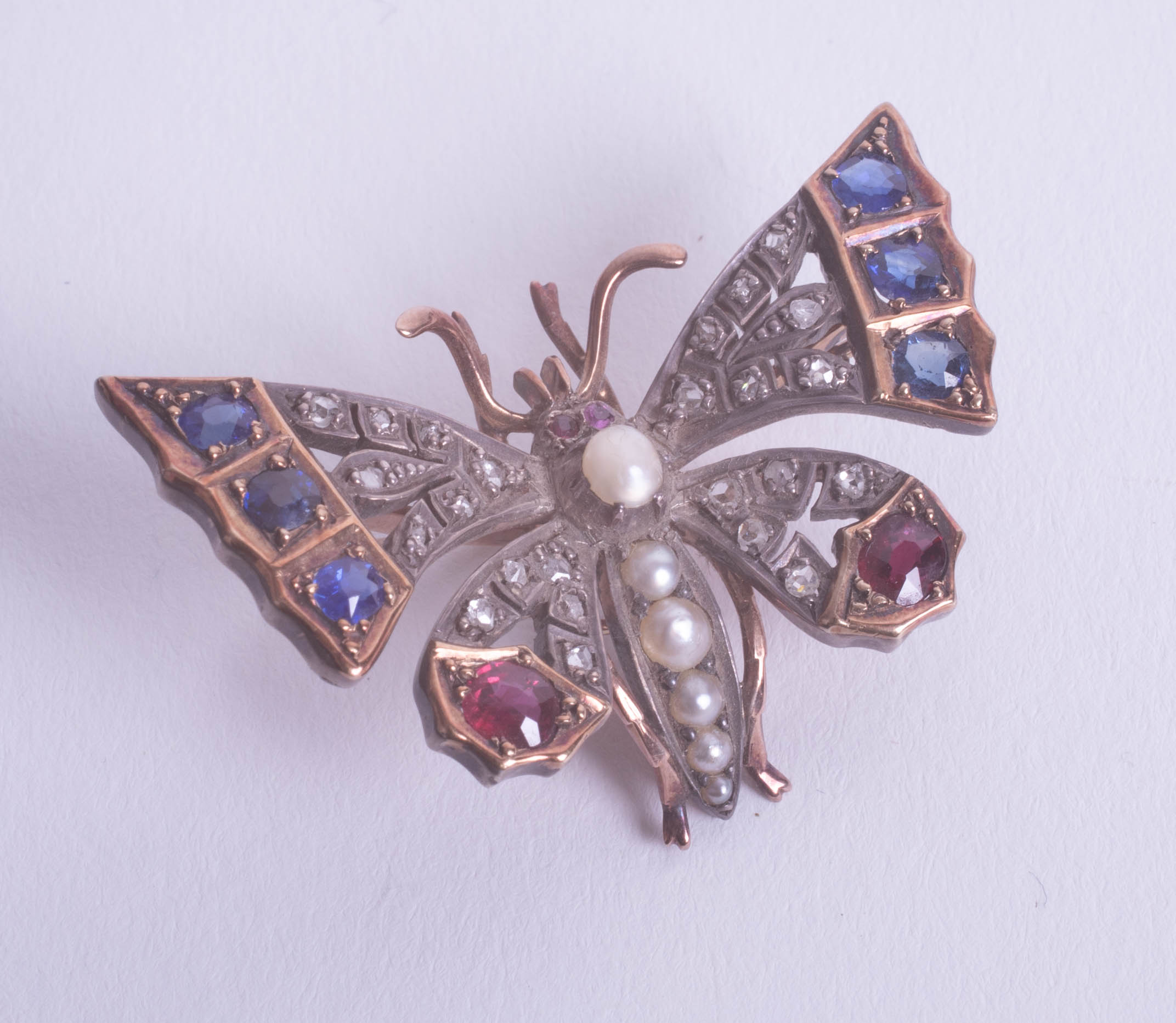 A Victorian ruby and diamond set butterfly brooch.