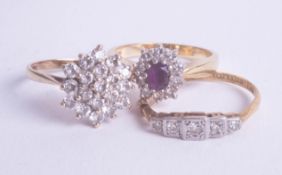 An 18ct amethyst and diamond cluster ring, together with two other dress rings (3) two 18ct approx