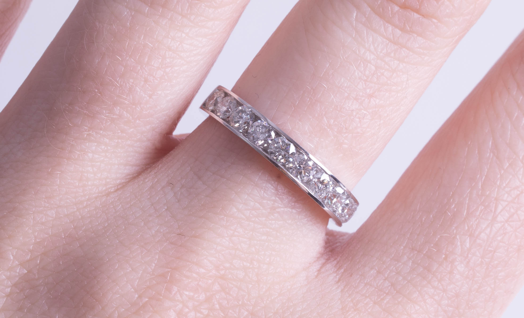 An 18ct white gold and diamond set half band eternity ring, size M. - Image 2 of 2