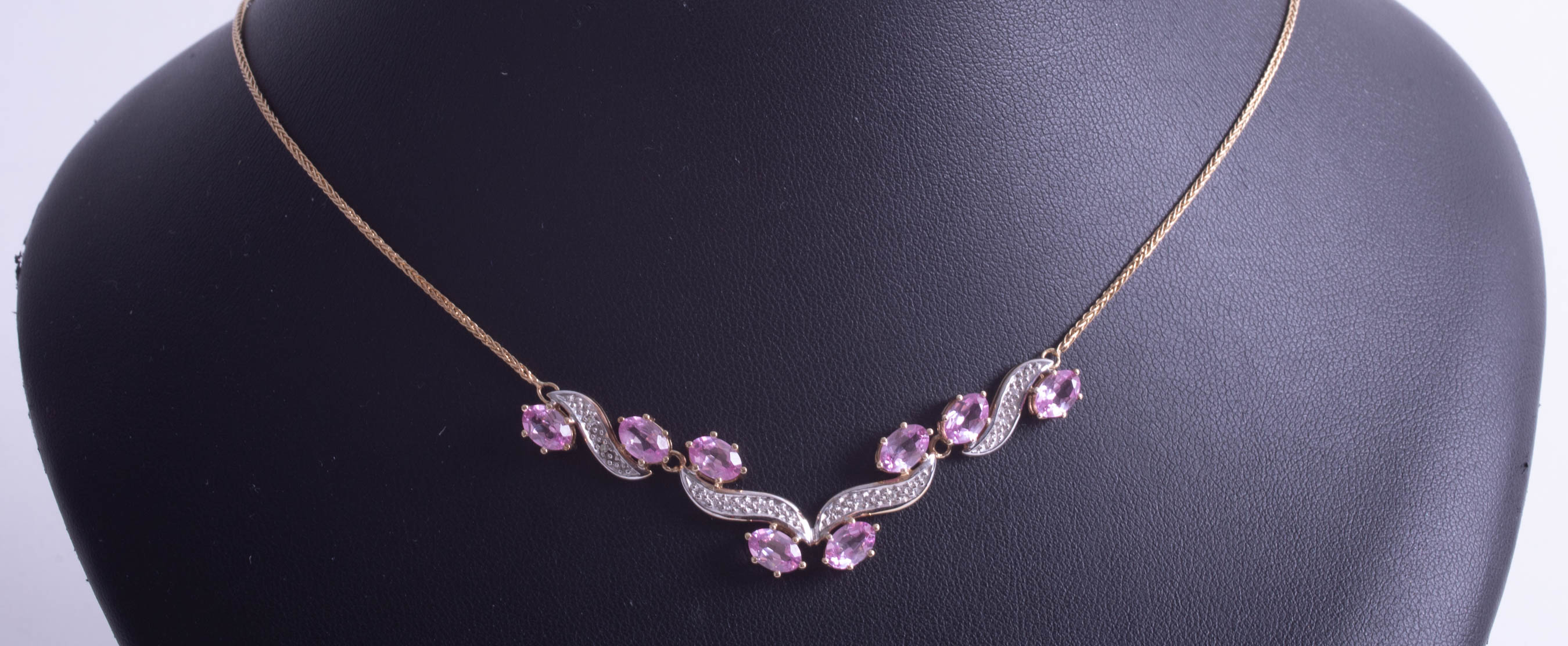 A stylish 14ct and pink sapphire and diamond set pendant. - Image 2 of 2