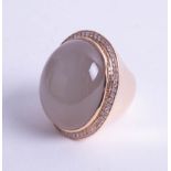 An impressive, huge moonstone and diamond set ring, signed Adler, size range O to Q.