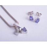 A modern tanzanite necklace and pair of earrings.