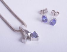 A modern tanzanite necklace and pair of earrings.