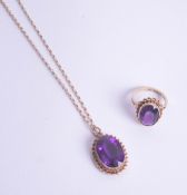 An amethyst pendant and matching ring set in 9ct gold.
