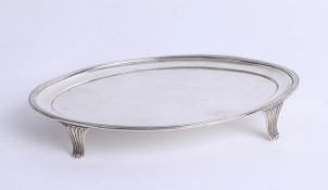 A Geo III silver waiter, maker 'C.F', London, circa 1802, the oval top on four curl legs, length