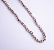 A gold link necklace, damaged, 57.70g.