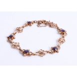 An amethyst and pearl set bracelet in yellow gold? 14.60g.