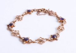 An amethyst and pearl set bracelet in yellow gold? 14.60g.