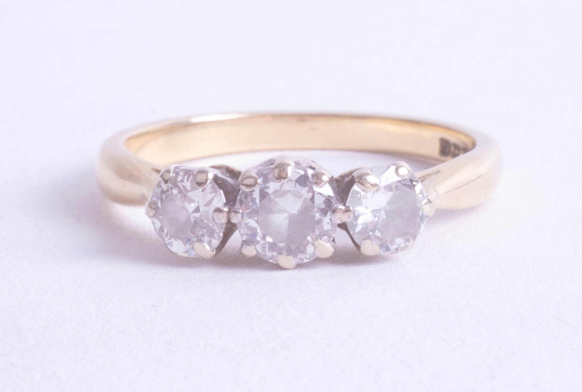 An 18ct three stone ring, the centre stone approximately 0.4 to 0.5 carats, size P, being sold to - Image 2 of 2