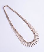 A 9ct fringe necklace, 18.30g.