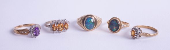 Four 9ct gold dress rings, approx 12.50g, together with a unmarked yellow metal and opal set dress