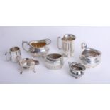 A small silver tankard, together with various silver cream jugs, sucre, and crystal mug (7) 29.