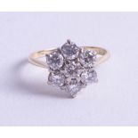 An 18ct diamond cluster ring, approx. 1.40ct, size N/O.