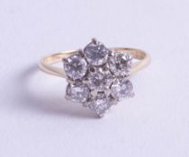 An 18ct diamond cluster ring, approx. 1.40ct, size N/O.