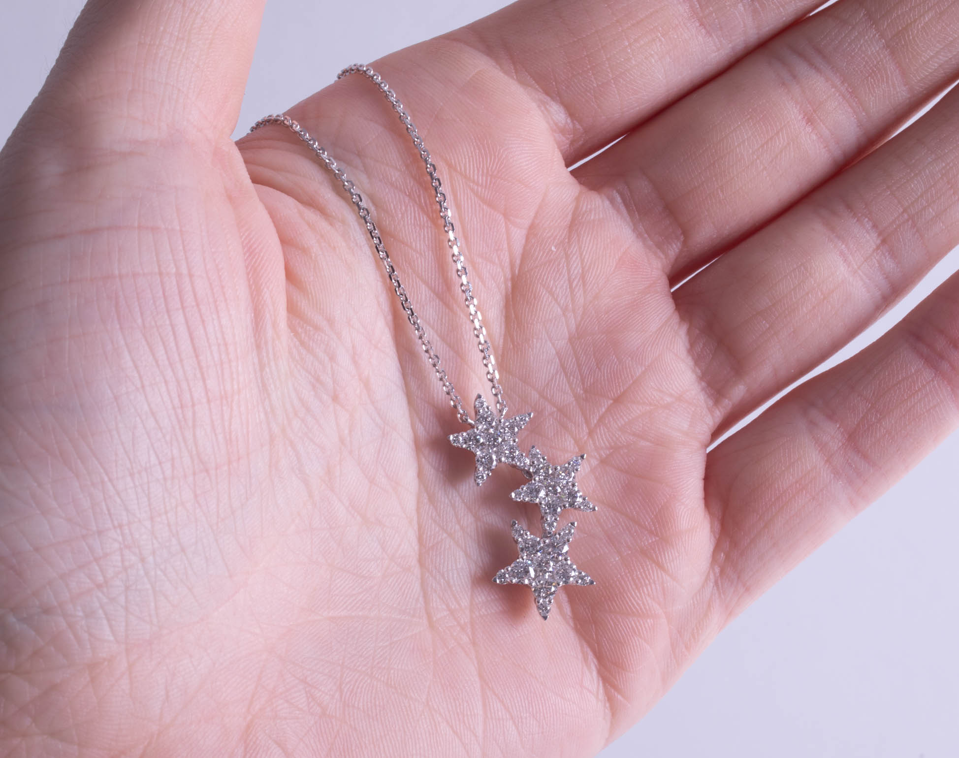 An 18ct diamond three star pendant. - Image 2 of 3