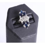 A stylish platinum sapphire and diamond set fancy ring, the mark rubbed, size P.
