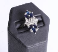 A stylish platinum sapphire and diamond set fancy ring, the mark rubbed, size P.