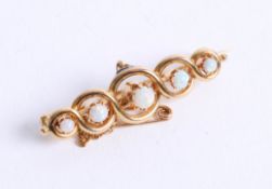 A five stone opal set bar brooch, 5.10g.