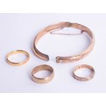 A 9ct broken bangle together with two 9ct wedding bands, approx 9.4g and one 22ct wedding band,