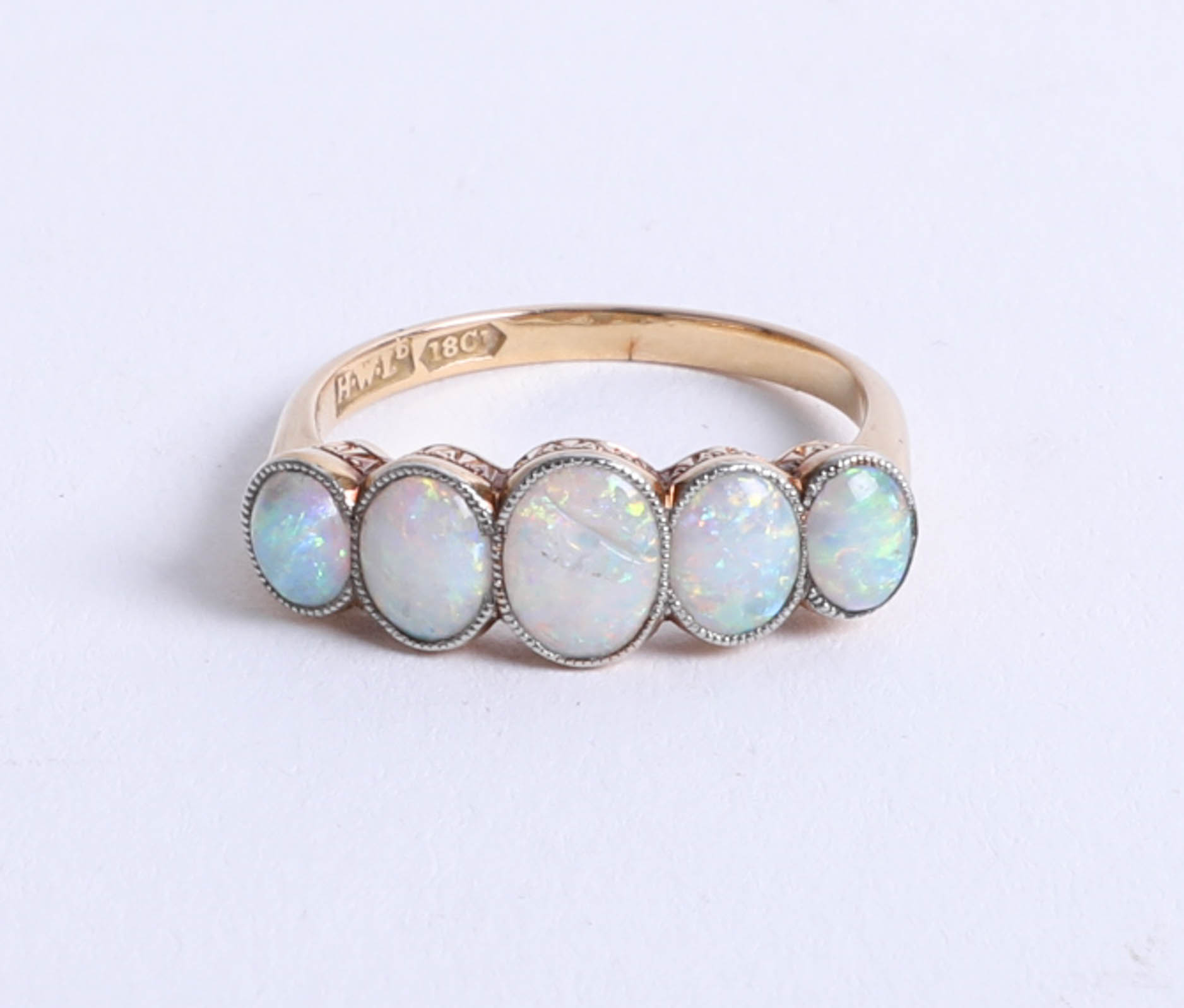 An 18ct five stone and opal set ring, size P.