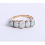 An 18ct five stone and opal set ring, size P.