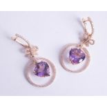An impressive pair of 14ct amethyst and diamond set earrings.
