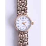 A ladies 9ct gold wristwatch with original box and purchase guarantee, dated 28th October 1994.