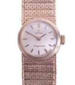 Omega, a 9ct ladies Ladymatic wristwatch with silver baton dial, boxed, approximately 33.50g.