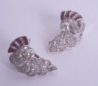 A pair of stylish art deco ruby and diamond set earrings in fitted box.