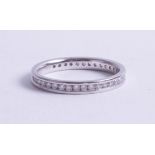 A platinum and diamond set eternity ring, size M.