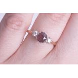 An 18ct ruby and diamond three stone ring size K, being sold to raise money for Dog Rescue Cyprus.