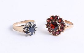 A 9ct and garnet set cluster ring, together with a 9ct sapphire and diamond cluster ring, 8.30g (2)