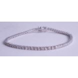 An 18ct diamond set line bracelet approx. 3.80ct, length 18.5cm.