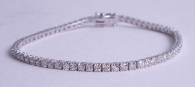 An 18ct diamond set line bracelet approx. 3.80ct, length 18.5cm.