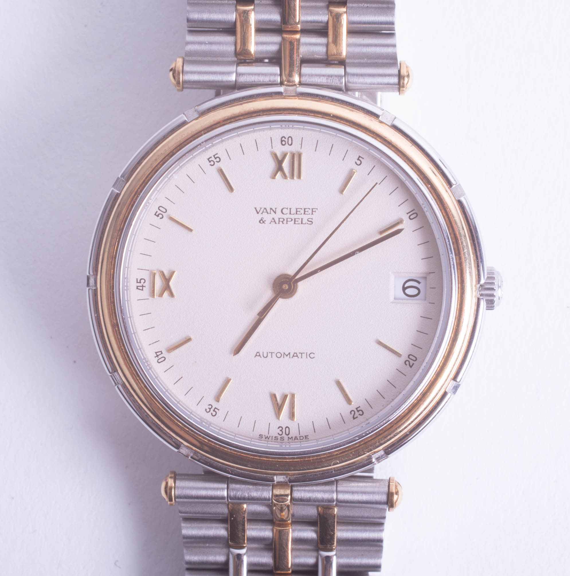 Van Cleef & Arpels (Paris), an 18ct and steel two tonne automatic date bracelet wristwatch, 'La
