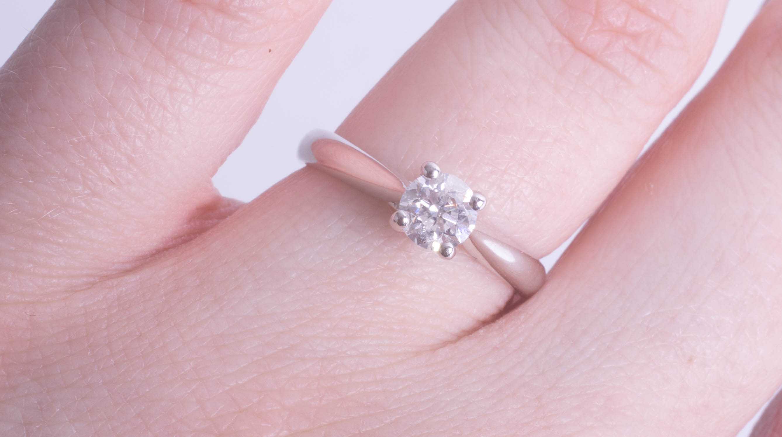 A modern 18ct diamond solitaire ring, approx 0.50 carat, size L.