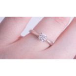 A modern 18ct diamond solitaire ring, approx 0.50 carat, size L.