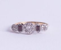 A stylish 18ct diamond and ruby set ring, size O.