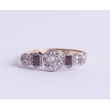 A stylish 18ct diamond and ruby set ring, size O.