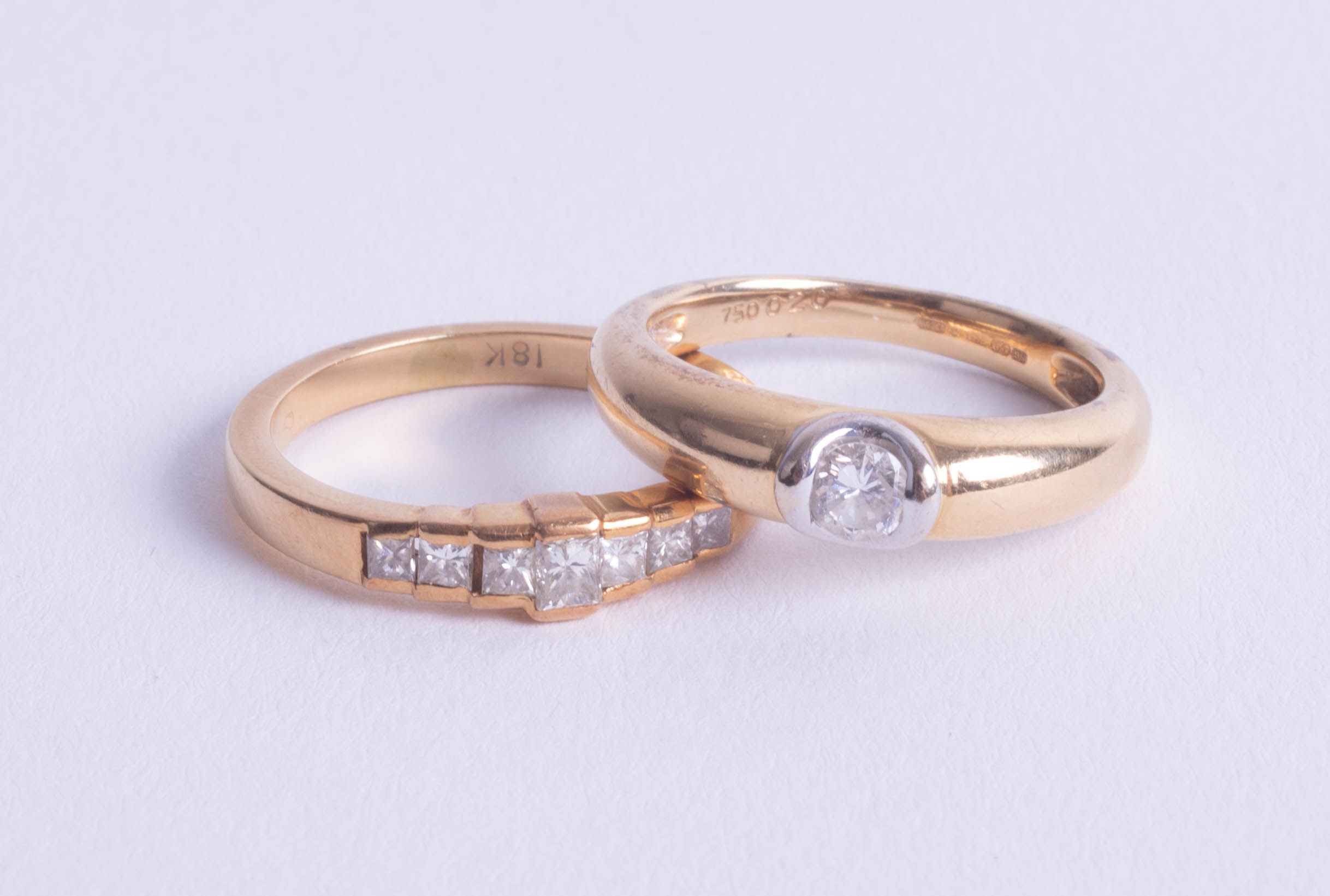 Two 18ct and diamond set dress rings, approximately 8.00g, size N.