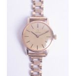 Omega, a ladies 9ct gold, manual wind, bracelet watch with champagne baton dial, circa 1976- 1981,