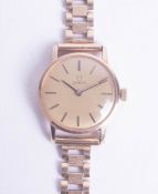 Omega, a ladies 9ct gold, manual wind, bracelet watch with champagne baton dial, circa 1976- 1981,