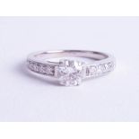 An 18ct white gold diamond solitaire ring approx. 0.60ct with diamond analysis report card (