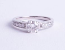 An 18ct white gold diamond solitaire ring approx. 0.60ct with diamond analysis report card (