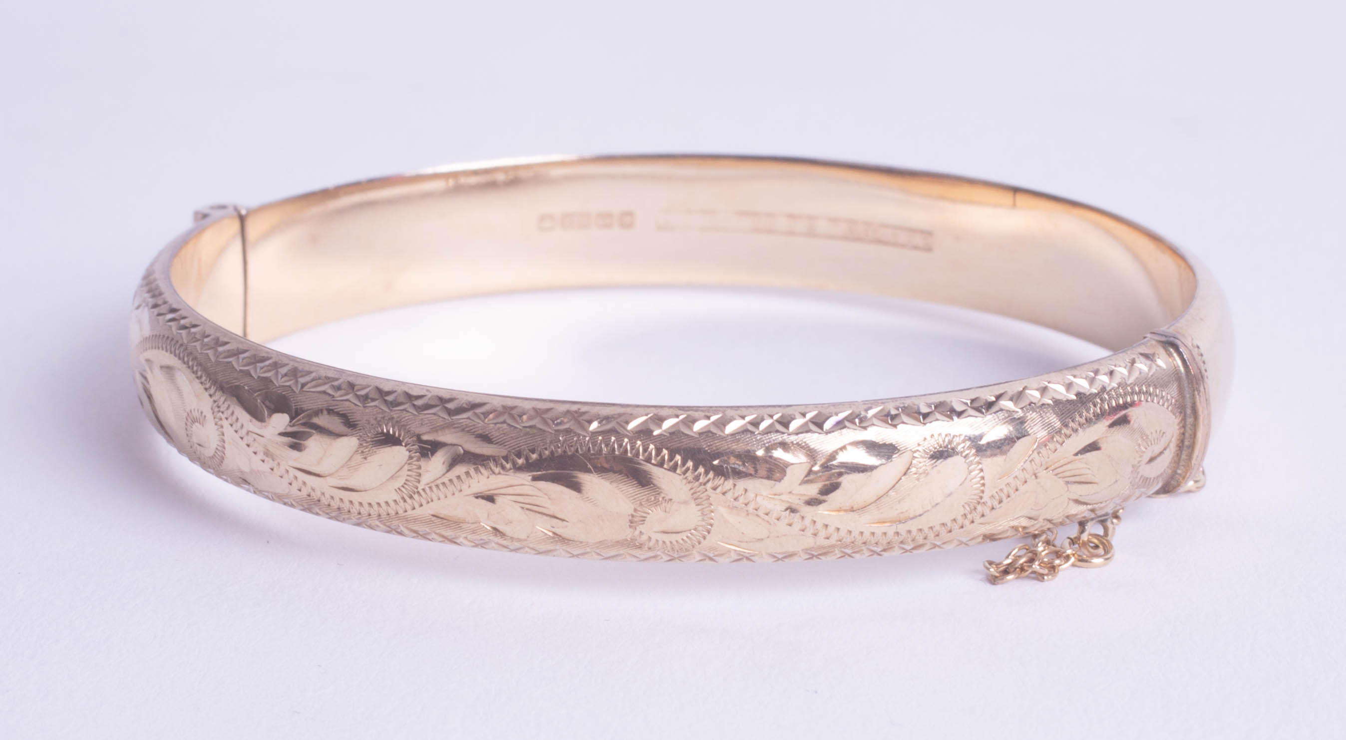 A 9ct gold bangle, approx 10.60g.