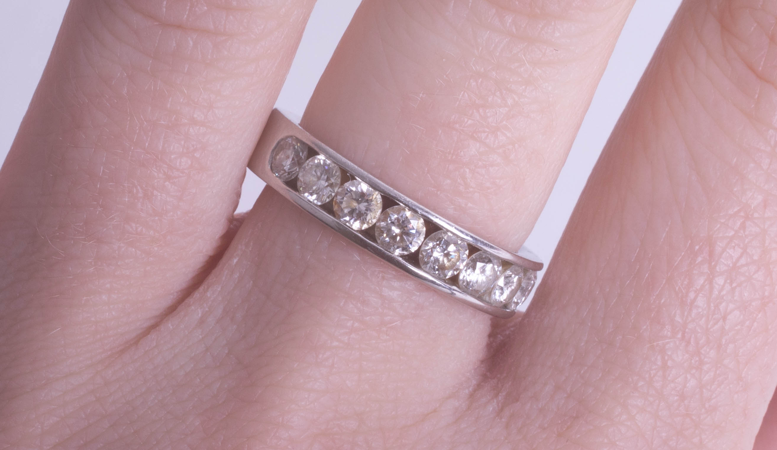 A fine platinum and diamond set half band eternity ring, with Hatton Garden jewellery grading