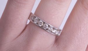 A fine platinum and diamond set half band eternity ring, with Hatton Garden jewellery grading