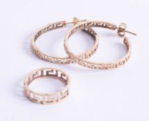 A pair of 14ct hoop earrings of Greek key cut design, marked '585', together with a similar