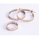 A pair of 14ct hoop earrings of Greek key cut design, marked '585', together with a similar